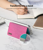 Card Holder | Flip [2 Pack] - Pink fabric card holder attached to a phone, folded to act as a stand with a non-slip silicon pad.