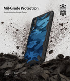 Galaxy A70 Case | Fusion-X - Blue camo phone case with black bumper surrounded by flying debris and military-grade text.