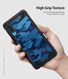 Galaxy A70 Case | Fusion-X - Hand holding a phone with a blue camo textured case and black reinforced corners.