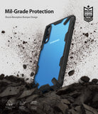 Galaxy A70 Case | Fusion-X - Black rugged phone case on a blue Samsung Galaxy A70 surrounded by flying dirt and debris.