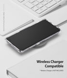 Galaxy S10 5G Case | Fusion - A glitter clear phone case on a Galaxy S10 5G resting on a wireless charger on a white desk.