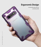Galaxy S10 Case | Fusion-X - A hand holds a Samsung Galaxy S10 in a purple, rugged, transparent Ringke Fusion-X protective case.