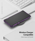 Galaxy S10 Case | Fusion-X - Purple Galaxy S10 in a Fusion-X case charging wirelessly on a desk next to a white keyboard.