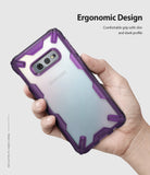 Galaxy S10e Case | Fusion-X - Hand holding a Samsung Galaxy S10e in a purple, rugged, transparent Fusion-X protective case.