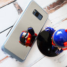Galaxy S8 Plus Case | Mirror - Reflective phone case showing a toy robot standing on a white wooden surface.