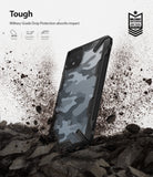 Google Pixel 4 XL Case | Fusion-X - Camo black phone case standing on rocky ground amidst a dust cloud with military-grade drop protection icons.