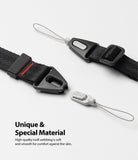 Hand Strap | Black / Neon Orange - Black webbing strap with Ringke branding, plastic buckles, and a detachable grey loop.