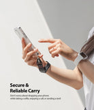 Hand Strap | Black / Neon Orange - Person holding a smartphone with a black wrist strap attached for secure carrying.