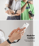 Hand Strap | Black / Neon Orange - A black wrist strap attached to a smartphone and a camera for secure, comfortable handling.
