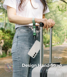 Hand Strap | Basic - A person wearing a green fabric wrist strap attached to a smartphone while holding a suitcase handle.