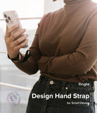 Hand Strap | Basic - Person wearing a black wrist strap attached to a smartphone in a clear case.