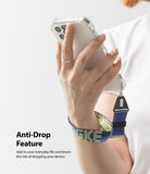 Hand Strap | Lettering - A person holding a smartphone with a blue and yellow patterned wrist strap attached for anti-drop security.