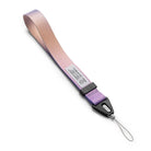 Hand Strap | Basic - A pink and purple ombre fabric wrist strap with a black plastic connector and a thin loop attachment.