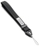 Hand Strap | Basic - A black nylon camera strap with a gray plastic quick-release buckle and a white loop tag, shown on a clean white background.