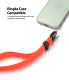 Hand Strap | Black / Neon Orange - Neon orange hand strap attached to a smartphone case with a black connector.