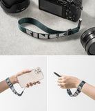 Hand Strap | Lettering - Dark green woven hand strap with white Ringke lettering attached to a camera and smartphone.