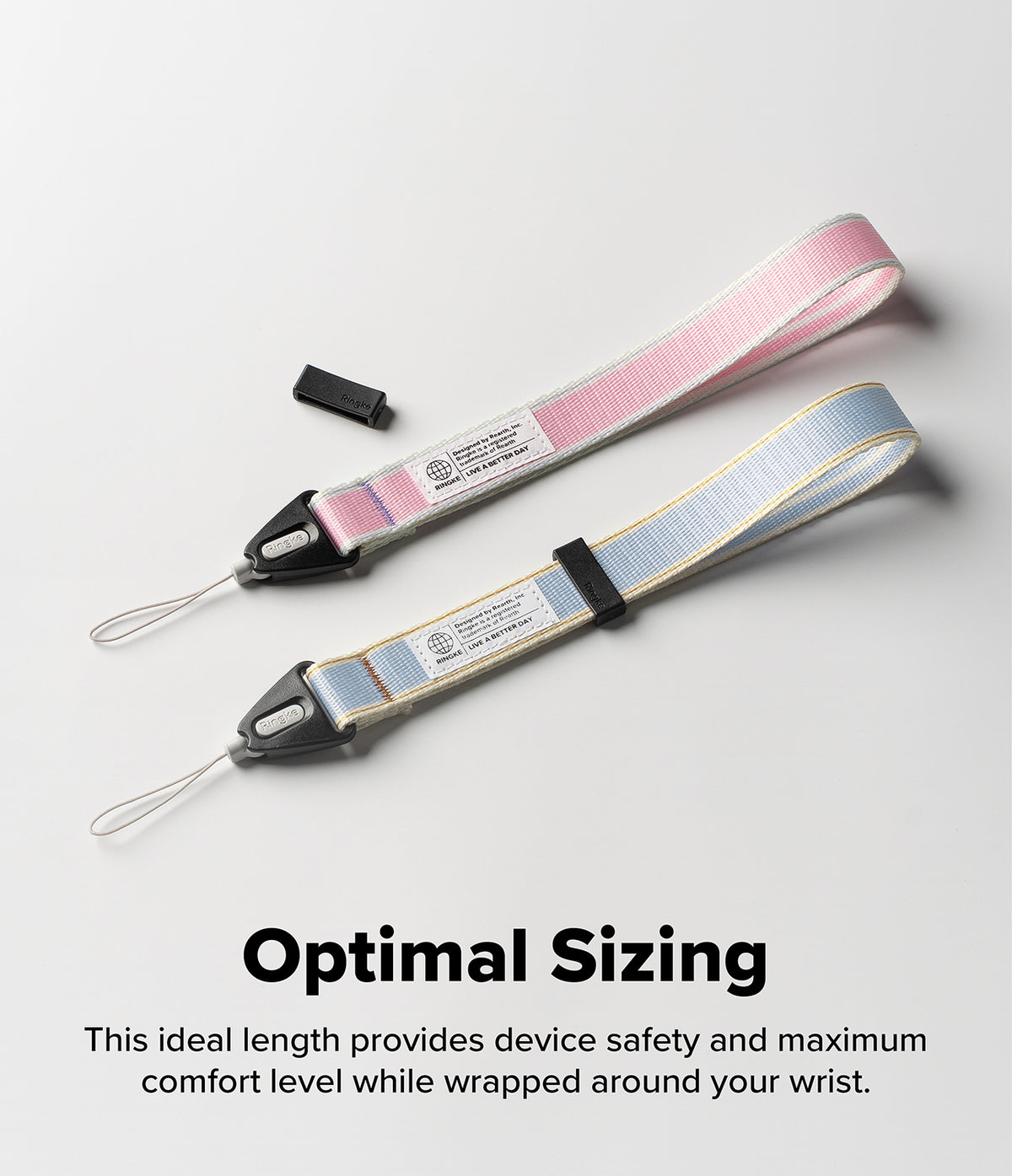 Design Hand Strap - Two fabric wrist straps in pink and blue with black connectors and white branding tags on a white surface.