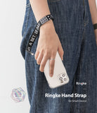 Hand Strap | Lettering - A person wearing a black wrist strap with white text around their wrist while holding a smartphone.