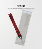 Hand Strap | Lettering - Red fabric hand strap with black lettering next to its clear, branded recyclable packaging pouch.