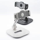Iron Tablet Stand - Two adjustable tablet stands in white and black with folding arms and secure device grips.