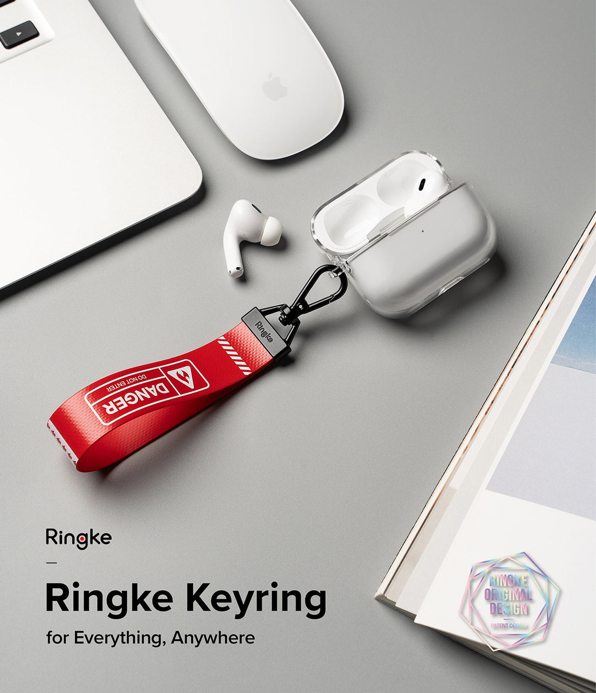 Key Ring Strap | Danger - Red Danger-themed fabric strap with a black carabiner attached to a clear AirPods case on a desk.