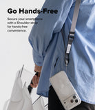 Design Lanyard Strap - Person wearing a gray shoulder strap attached to a clear smartphone case, holding a white umbrella.