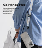 Design Lanyard Strap - A person in a blue shirt wears a light blue and white striped shoulder strap attached to a clear phone case.