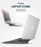 Laptop Stand - Silver laptop elevated by a compact, gray adhesive stand shown from side and rear angles.