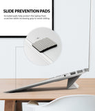 Laptop Stand - Close-up of a textured gray anti-slip pad attached to the underside of a laptop on a stand.