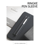 Pen Sleeve - A dark grey adhesive pen sleeve holding a white stylus on a tablet case next to a study planner.