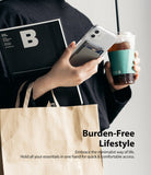 Card Holder | Slot [3 Cards] - Person holding a phone with a grey adhesive card slot, a magazine, and an iced coffee.