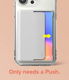 Card Holder | Side Slot - A light gray card holder on a clear phone case with a yellow arrow indicating a card sliding out.