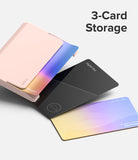 Card Holder | Side Slot - A light pink card holder displaying three cards, including a black digital key and a gradient smart card.