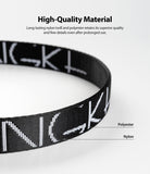 Shoulder Strap | Lettering - Close-up of a black nylon strap with white lettering, highlighting its durable material construction.