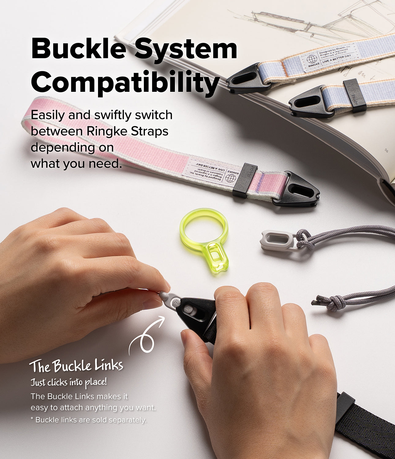 Design Shoulder Strap - Hands clicking a grey buckle link into a black strap connector on a white surface with other straps.