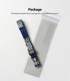 Shoulder Strap | Lettering - Blue shoulder strap with yellow lettering resting on a clear, branded product pouch.