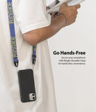 Shoulder Strap | Lettering - Person wearing a blue strap with yellow lettering attached to a black smartphone case.