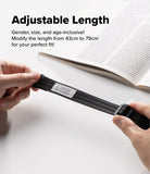 Design Shoulder Strap - A close-up of a person's hands stretching a black adjustable elastic strap, with an open book blurred in the background and text reading 'Adjustable Length' and 'Gender, size, and age-inclusive! Modify the length from 43cm to 79cm for your perfect fit!'.