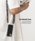 Shoulder Strap | Lettering - Person wearing a black phone case on a branded shoulder strap with white text against a white shirt.