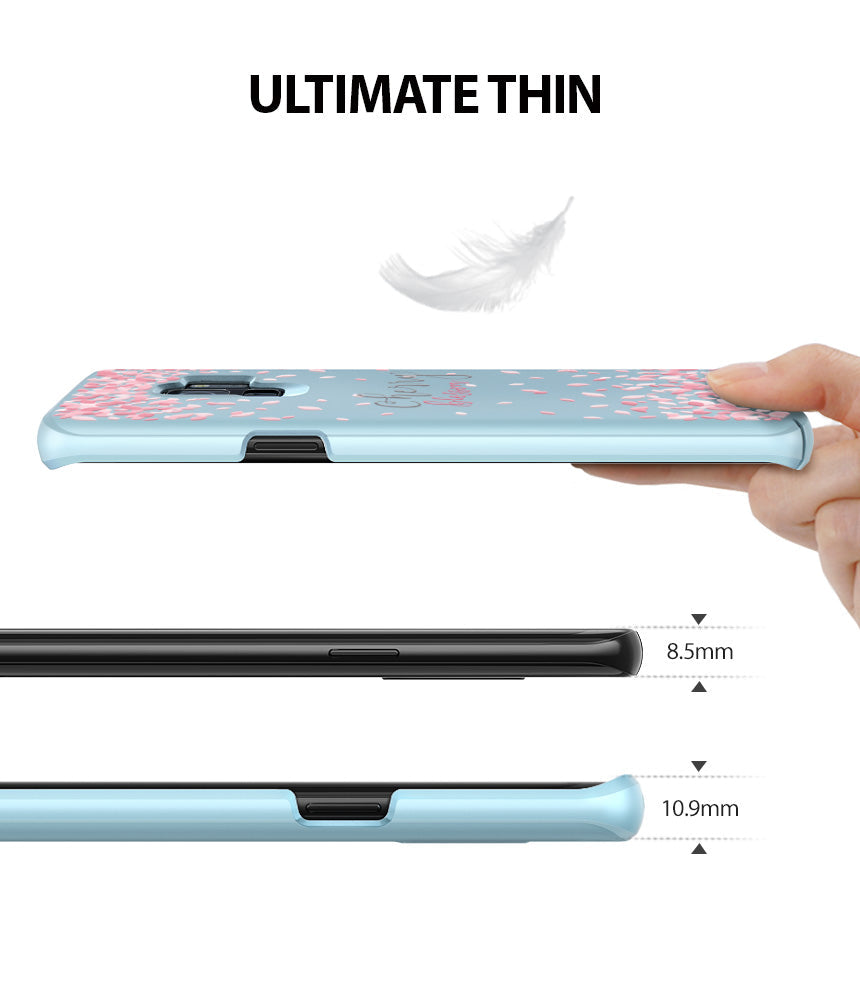 Galaxy S9 Case | Slim (Cherry Blossom) - A hand holds a light blue phone case with cherry blossom petals, showing its thin profile compared to a phone.