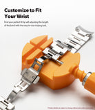 Galaxy Watch 46mm | Metal One Band - A metal watch band being adjusted by an orange resizing tool on a white surface.