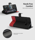 Galaxy S10 Case | Wallet - Black and red leather wallet case for Galaxy S10 shown in stand mode with a close-up of folding creases.