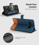 Galaxy S10 Case | Wallet - Navy and brown leather wallet case for Galaxy S10 folded into a stand for hands-free viewing.