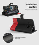 Galaxy S10e Case | Wallet - Black and red folding wallet case for Galaxy S10e propped up as a stand for hands-free viewing.