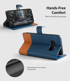 Galaxy S10e Case | Wallet - Navy and brown leather wallet case for Galaxy S10e folded into a stand for hands-free viewing.