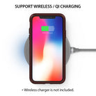 iPhone X Case | Wave - iPhone X in a dark case resting on a wireless charging pad showing a 60% battery charge icon.