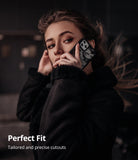 iPhone 11 Pro Case | Fusion-X Design - Woman holding a camo-patterned iPhone 11 Pro case to her ear in a dark setting.