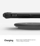 iPhone 11 Pro Case | Fusion-X Design - Side view of a black phone case hovering above a wireless charging pad.