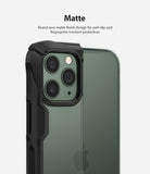 iPhone 11 Pro Max Case | Fusion-X Matte - Close-up of a matte black protective case on a green iPhone 11 Pro Max.