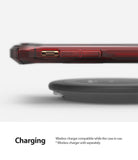 iPhone 11 Pro Case | Fusion-X - Ruby red phone case hovering above a black wireless charging pad.